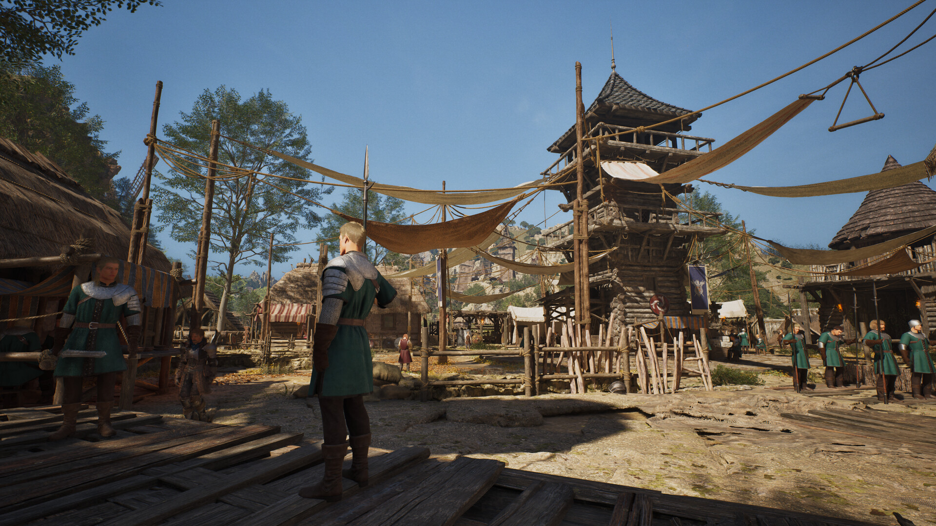 A sunlit timber harbour village with rope bridges and a lone figure in the foreground
